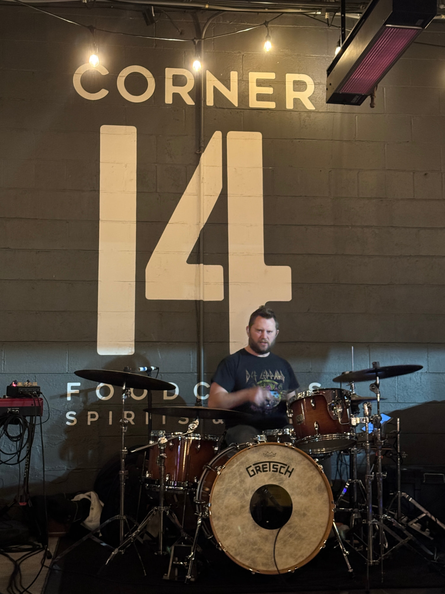 Jeramy Burchett playing drums during a live Drift & Flutter set